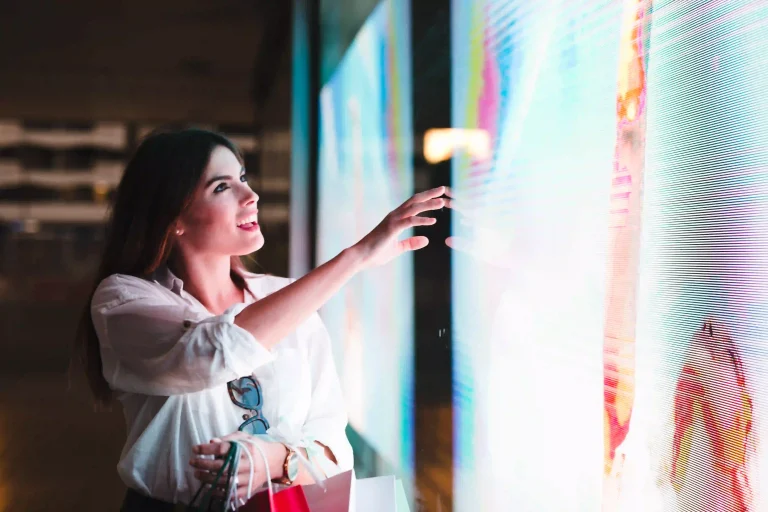 shopping-girl-looking-store-window-led screen